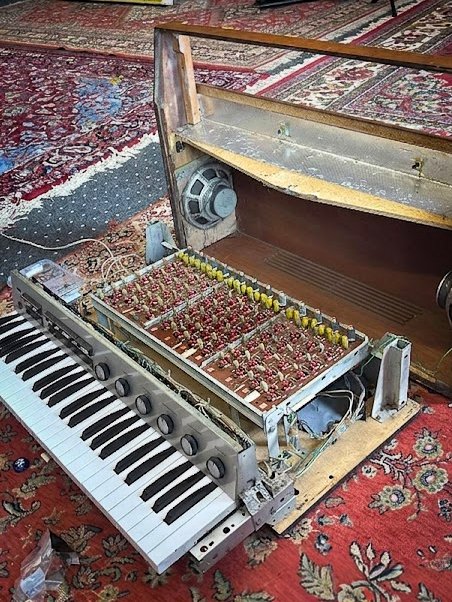 The instrument opened, speaker and electronics exposed