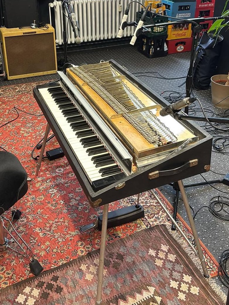 The instrument opened, action and harp exposed